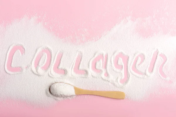 Scattered collagen on a pink background close-up. — Stock Photo, Image