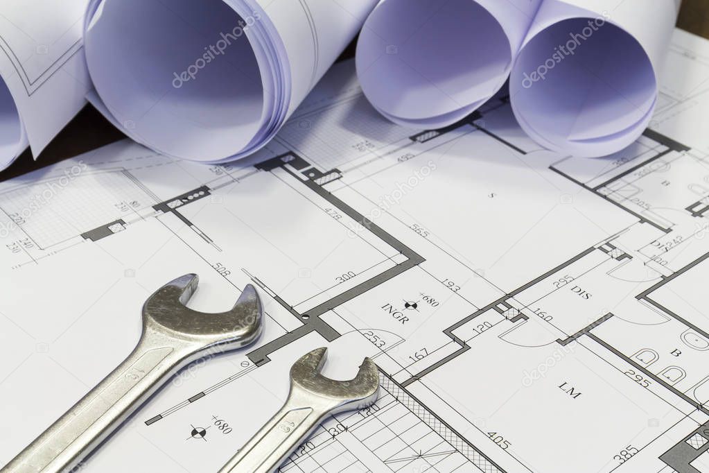 Maintenance and service: Wrench and project drawings with residential building