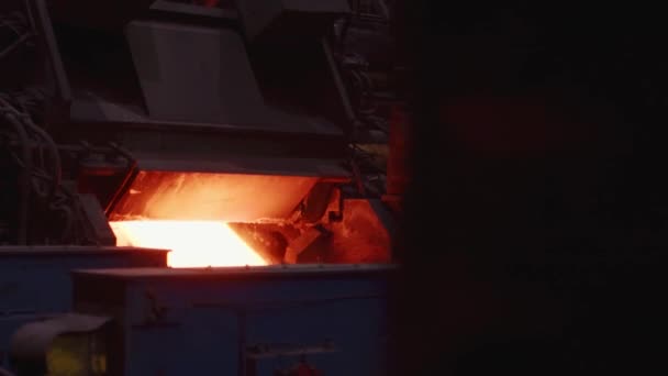 The hot sheet of metal moves on the conveyor. Slow motion. — Stock Video