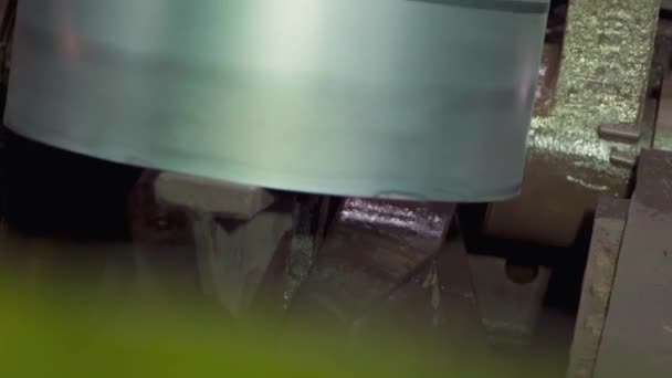 Moving a roll of metal sheets on a conveyor. — Stock Video