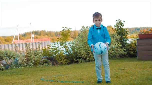 Boy Playing in Garden Among Beautiful Flower Beds — Stock Video