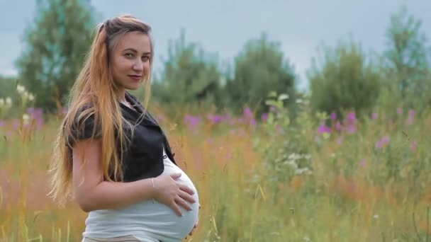 Pregnant Expectant Child Standing in Field — Stock Video