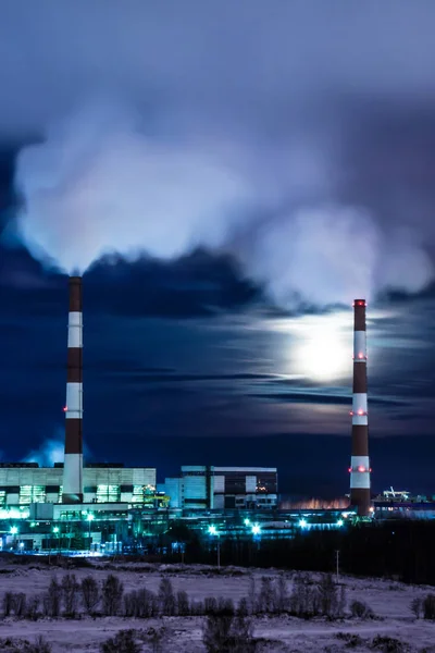 The cooling towers of thermal power station in the winter night
