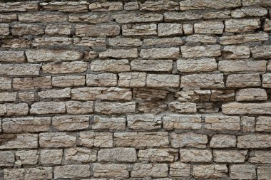Kahverengi ve gri kaldırım taşı veya tuğla kule, kale veya kale duvarı arka planı veya dokusu
