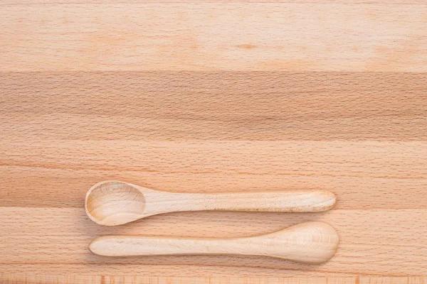 Wooden spoon on wooden background — Stock Photo, Image