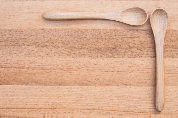 Wooden spoon on wooden background