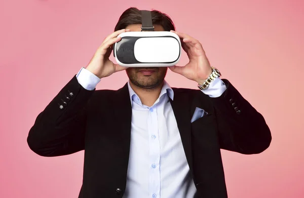 Arab Man experiencing virtual reality wearing virtual reality glasses