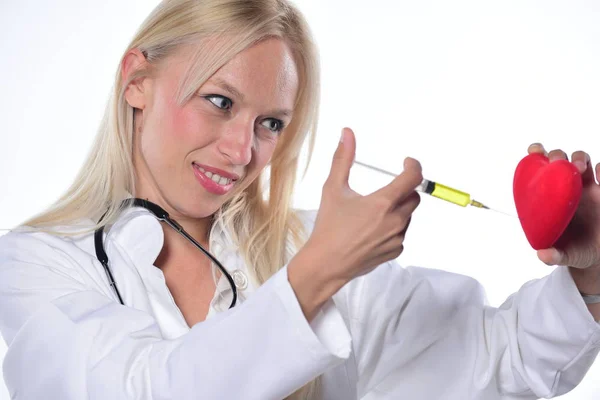 Young Female Doctor Making Injection Red Heart Isolated White Background — Stock Photo, Image