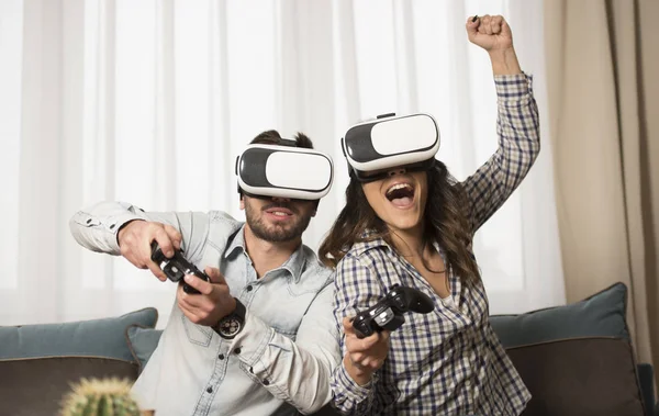 friends playing video games wearing virtual reality glasses