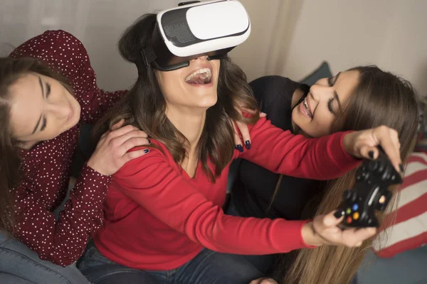 friends playing video games wearing virtual reality glasses