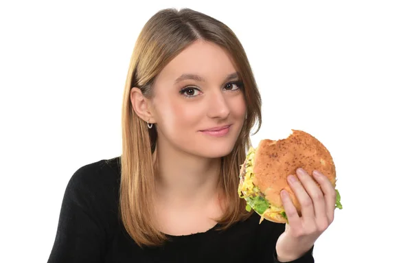 Portréja Egy Szép Fiatal Lány Eszik Egy Hamburgert Fehér Háttér — Stock Fotó