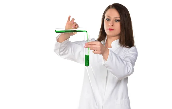 Chemical laboratory scene: Attractive young PhD student scientist observing the green indicator color shift in the glass tube.