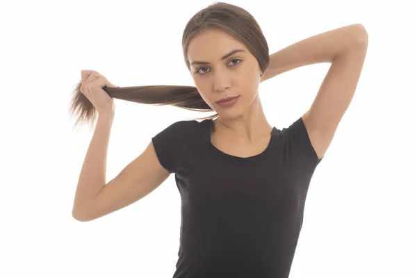 Bela Jovem Segurando Seu Cabelo Rabo Cavalo Fundo Branco — Fotografia de Stock