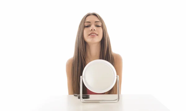 stock image Portrait of beautiful young woman with mirror isolated on white background