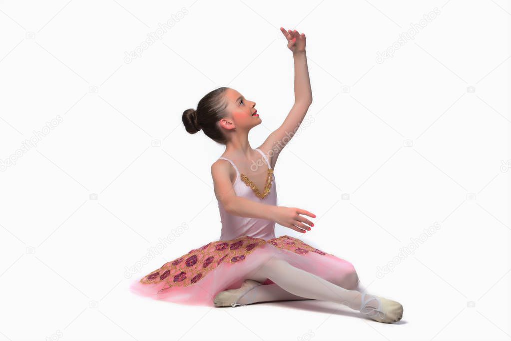 Beautiful girl ballet dancer. Posing in studio