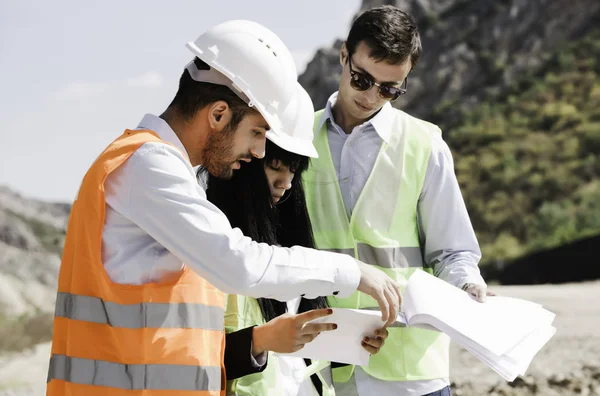 Civil engineers on construction site. Construction concept