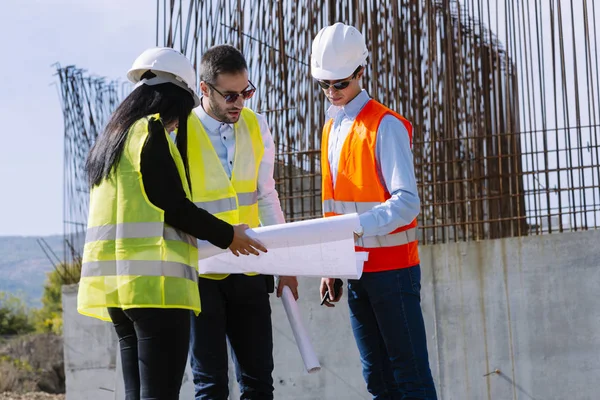 Civil engineers on construction site. Construction concept