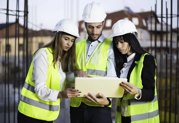 Civil engineers on construction site. Construction concept