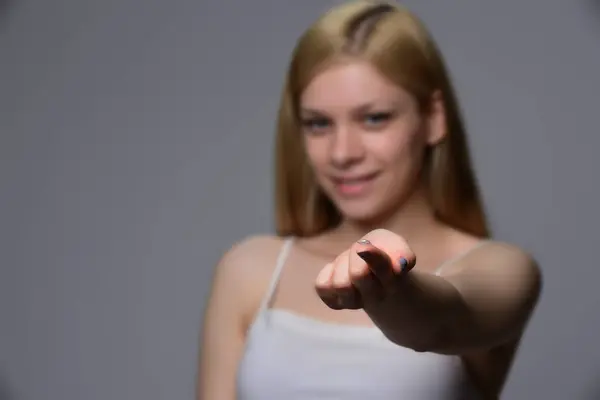 Contact Lens For Vision. Young woman holding a contact lens on a finger