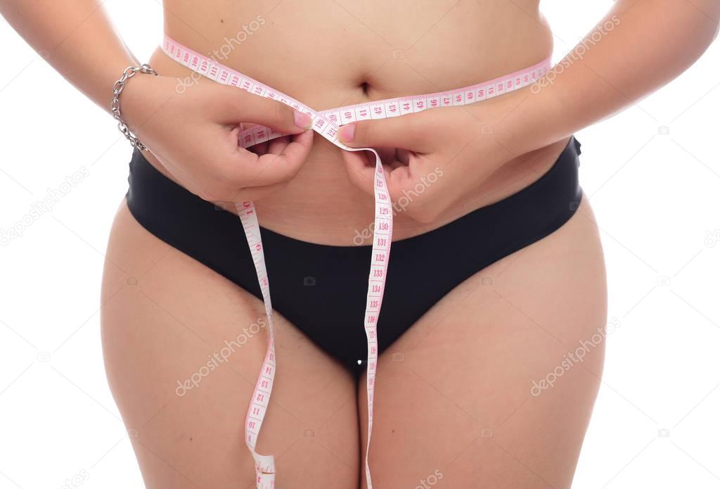 overweight woman with measuring tape isolated on white background