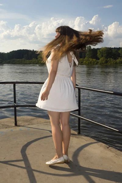 white long hairy women whirl outdoors