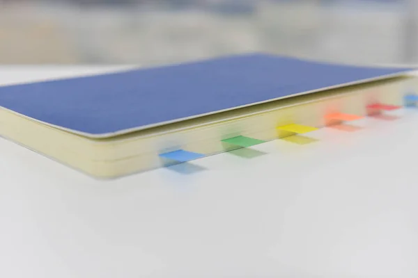 Blue notebook with note flags — Stock Photo, Image