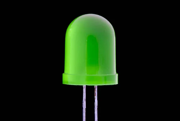 Macro of mini  green Acrylic LED bulb with black background - Low key — Stock Photo, Image