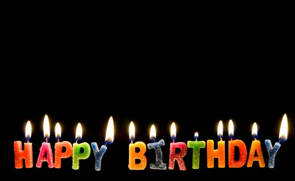 Colorful of happy birthday candle with flame lighting on the black