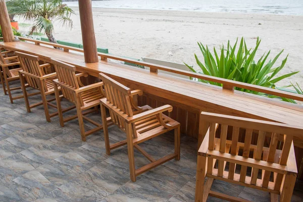 table and wooden seats at the beach