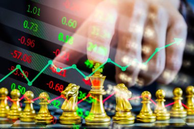 Chess game on chess board on stock market or forex trading graph