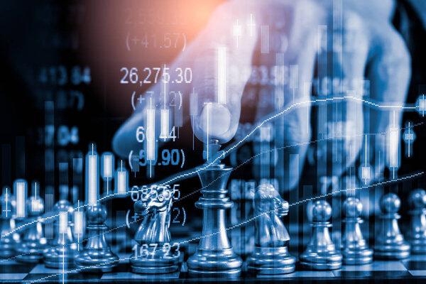 Chess game on chess board on stock market or forex trading graph