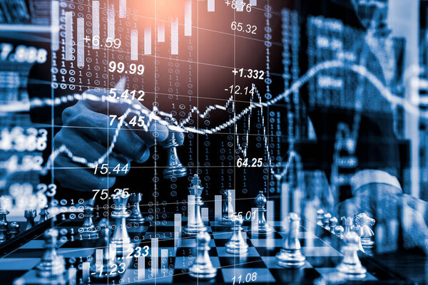 Chess game on chess board on stock market or forex trading graph