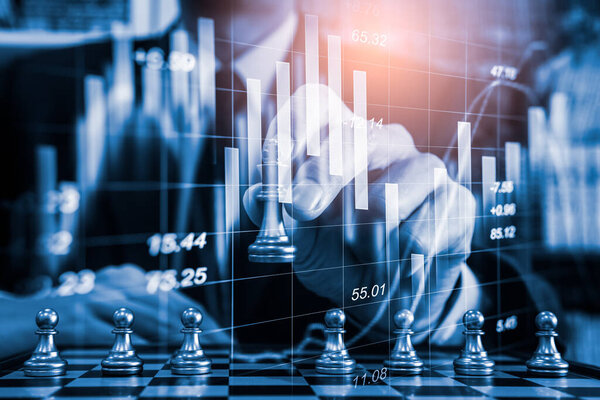 Chess game on chess board on stock market or forex trading graph chart for financial investment concept. Economy trends for digital business marketing strategy analysis. Abstract finance background.