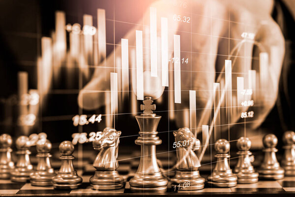 Chess game on chess board on stock market or forex trading graph chart for financial investment concept. Economy trends for digital business marketing strategy analysis. Abstract finance background.