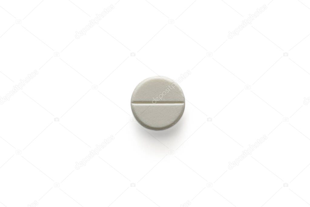 Single round white pill on white isolated background with clipping path and copy space. Medical and clinical concept. Close Up macro shot to present pill texture. Paracetamol tablet for painkiller.