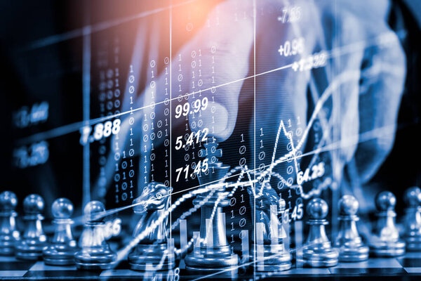 Chess game on chess board on stock market or forex trading graph chart for financial investment concept. Economy trends for digital business marketing strategy analysis. Abstract finance background.