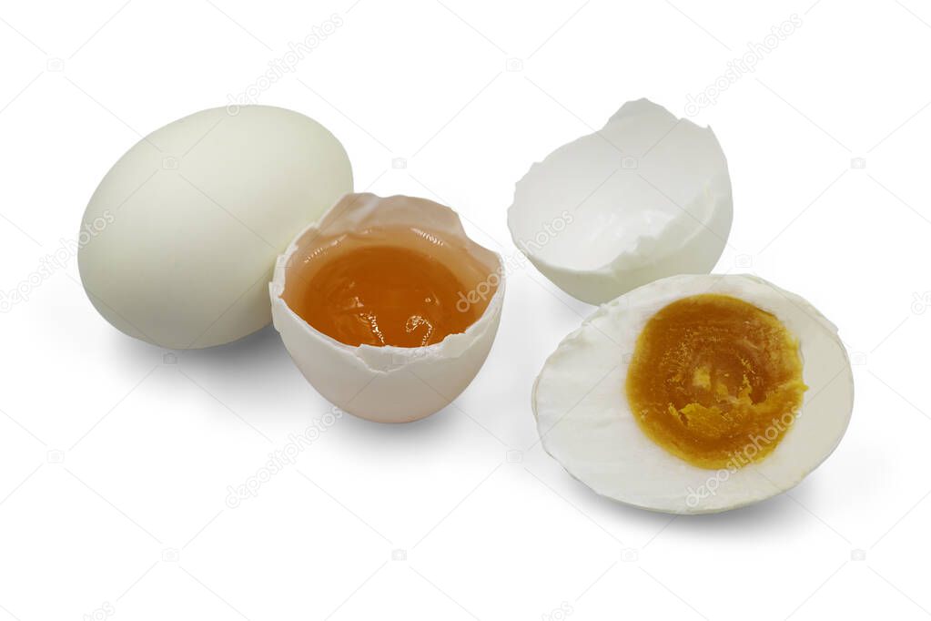 Organic raw and boiled salted egg on white isolated background with clipping path. Salted duck egg is popular Thai food so delicious with salty and creamy for cooking and bakery. Food preserve concept