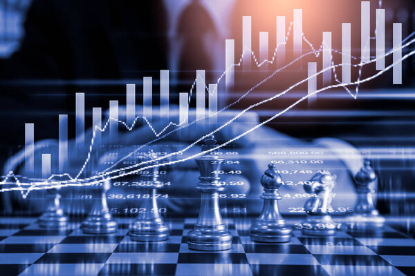 Chess game on chess board on stock market or forex trading graph chart for financial investment concept. Economy trends for digital business marketing strategy analysis. Abstract finance background.