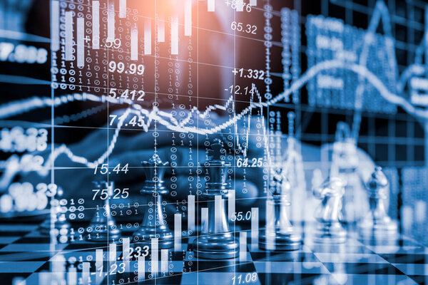 Chess game on chess board on stock market or forex trading graph chart for financial investment concept. Economy trends for digital business marketing strategy analysis. Abstract finance background.