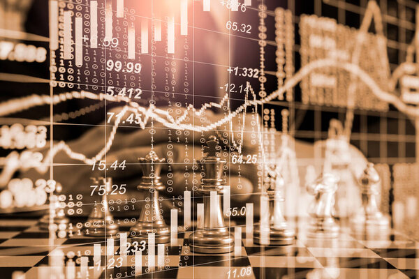 Chess game on chess board on stock market or forex trading graph chart for financial investment concept. Economy trends for digital business marketing strategy analysis. Abstract finance background.