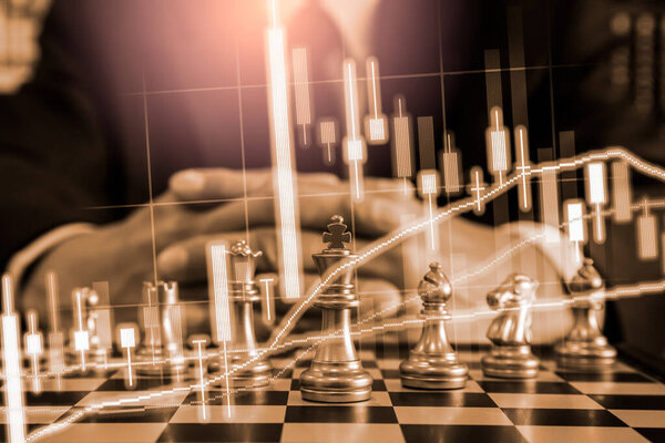 Chess game on chess board on stock market or forex trading graph chart for financial investment concept. Economy trends for digital business marketing strategy analysis. Abstract finance background.