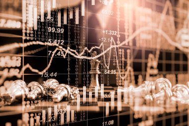Chess game on chess board on stock market or forex trading graph chart for financial investment concept. Economy trends for digital business marketing strategy analysis. Abstract finance background.