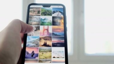 El kullanımı Instagram uygulaması akıllı telefon gezinme peyzaj hashtag üst sıralama fotoğrafları 