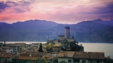 The enchanted lake village of Malcesine in Italy on the Lake Garda with vintage dreamlike film ruined effects