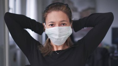 horizontal background of woman wearing surgical mask for corona virus isolation clipart