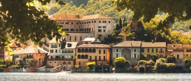 horizontal background of italy village web banner of Piedmont region Orta Lake Novara province  clipart