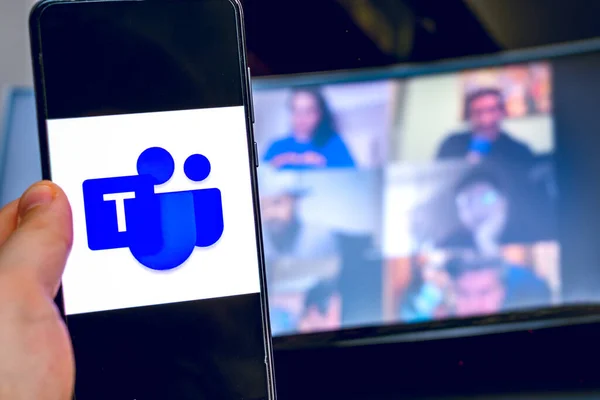 Hand use videoconference app icon of Microsoft Teams on smartphone. — Stock Photo, Image