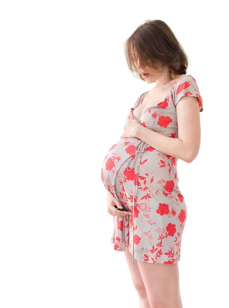 Lächelnde Schwangere hält ihren Bauch — Stockfoto