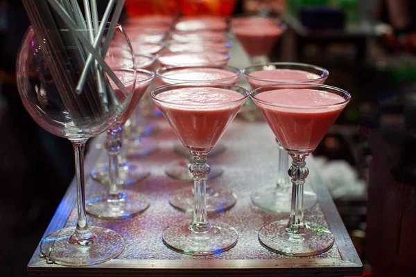 Glasses with rose Smoothies coctails on the bar