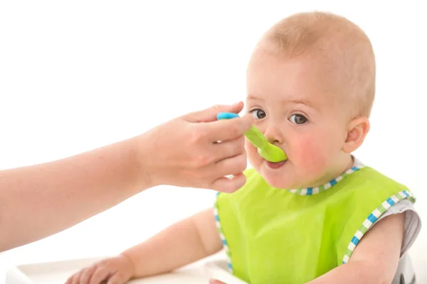 Parent feeding infant child — Stock Photo, Image